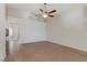 A bright, spacious bedroom with tile floors, a ceiling fan, and neutral walls, offering comfort and style at 4629 Cattleman Ave, North Las Vegas, NV 89031