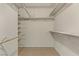 Walk-in closet with built-in shelving and racks, providing organized storage for clothing and accessories at 4629 Cattleman Ave, North Las Vegas, NV 89031