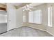 An eat-in kitchen featuring a stainless steel refrigerator, tile flooring, and a ceiling fan at 4629 Cattleman Ave, North Las Vegas, NV 89031