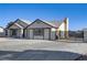 Single-story home with gated parking and a neutral color scheme at 4629 Cattleman Ave, North Las Vegas, NV 89031