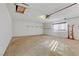 A large garage with high ceilings offers lots of space for parking and storage at 4629 Cattleman Ave, North Las Vegas, NV 89031