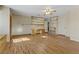 Spacious living room featuring wood flooring and built-in shelving at 4629 Cattleman Ave, North Las Vegas, NV 89031