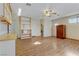 View of the living room with wood flooring and built in shelving at 4629 Cattleman Ave, North Las Vegas, NV 89031