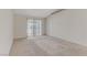 A bare living room with carpeted floor and lots of natural light at 4629 Cattleman Ave, North Las Vegas, NV 89031