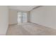 A bare living room with carpeted floor and lots of natural light at 4629 Cattleman Ave, North Las Vegas, NV 89031