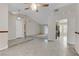 Open living room with tile flooring leading into other rooms at 4629 Cattleman Ave, North Las Vegas, NV 89031
