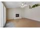 A spacious living room features a white brick fireplace and vaulted ceilings with ceiling fan at 4629 Cattleman Ave, North Las Vegas, NV 89031