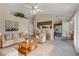 A staged living room with fireplace opens to the kitchen at 4629 Cattleman Ave, North Las Vegas, NV 89031