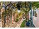 Lush garden pathway with charming decorations, offering a whimsical and peaceful retreat at 489 Beaconwood St, Henderson, NV 89052