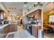 Open kitchen with stainless steel appliances and view into the dining and living areas at 489 Beaconwood St, Henderson, NV 89052