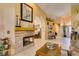 Bright living room featuring a fireplace, tile floors, and neutral color palette at 489 Beaconwood St, Henderson, NV 89052