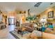 Spacious living room featuring tile floors, neutral walls, and an open layout at 489 Beaconwood St, Henderson, NV 89052