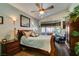 Bedroom with a ceiling fan, carpet flooring, and window seating area for relaxing at 489 Beaconwood St, Henderson, NV 89052