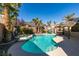 Backyard pool and spa area with a tiki hut and outdoor seating, creating a perfect space for outdoor entertaining at 489 Beaconwood St, Henderson, NV 89052