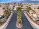 The community's entrance with palm trees and well manicured landscaping is beautiful at 5601 Quail Meadow Ct, Las Vegas, NV 89131