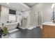 Modern bathroom boasts a freestanding tub, glass-enclosed shower, and stylish fixtures at 5601 Quail Meadow Ct, Las Vegas, NV 89131