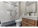 This bathroom features a glass enclosed shower and wooden vanity at 5601 Quail Meadow Ct, Las Vegas, NV 89131