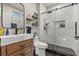 This updated bathroom features a glass shower, wooden vanity, and stylish fixtures at 5601 Quail Meadow Ct, Las Vegas, NV 89131
