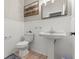Clean half bath features white wainscoting, large vanity, stylish faucet and neutral walls at 5601 Quail Meadow Ct, Las Vegas, NV 89131