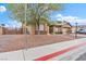 Well-maintained home featuring a landscaped front yard, and a side gate with ample privacy at 5601 Quail Meadow Ct, Las Vegas, NV 89131
