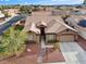 Charming single-story home with a well-maintained front yard and two-car garage in a Gathering-friendly neighborhood at 5601 Quail Meadow Ct, Las Vegas, NV 89131