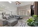 Spacious living room with vaulted ceilings, large windows with shutters, and open concept layout at 5601 Quail Meadow Ct, Las Vegas, NV 89131