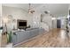Bright living room with hardwood floors, modern decor, and a comfortable gray sectional couch at 5601 Quail Meadow Ct, Las Vegas, NV 89131