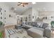 Open-concept living room with tile flooring, modern decor, and easy access to kitchen and dining area at 5601 Quail Meadow Ct, Las Vegas, NV 89131