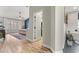 Ensuite bedroom with hardwood floors and large windows leading to the bathroom at 5601 Quail Meadow Ct, Las Vegas, NV 89131