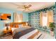 Staged main bedroom featuring modern decor, cozy furniture and large windows at 648 Utah St, Boulder City, NV 89005