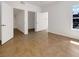 A bright bedroom with tiled floor, white walls, with a bathroom and a walk-in closet at 7255 W Sunset Rd # 1116, Las Vegas, NV 89113