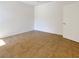 A bright bedroom featuring neutral walls, tiled floors, and a door on the right-hand side at 7255 W Sunset Rd # 1116, Las Vegas, NV 89113