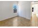 A bedroom featuring tiled floor, neutral walls, a sliding-door closet and a bright window at 7255 W Sunset Rd # 1116, Las Vegas, NV 89113