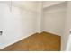 A well-lit walk-in closet with tile flooring and wire shelving at 7255 W Sunset Rd # 1116, Las Vegas, NV 89113