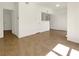 Open living room area with tile floors, bright white walls, and an open floorplan at 7255 W Sunset Rd # 1116, Las Vegas, NV 89113