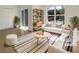 Bright living room featuring modern furniture, a large window, and tiled floors, virtually staged at 7255 W Sunset Rd # 1116, Las Vegas, NV 89113