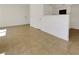 An open living area with tiled floors, seamlessly connected to the kitchen, perfect for modern living at 7255 W Sunset Rd # 1116, Las Vegas, NV 89113