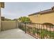 Outdoor balcony with metal railing offers a private view of the surrounding neighborhood at 7413 Old Compton St, Las Vegas, NV 89166