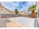 The backyard includes a concrete patio and desert landscaping at 7820 Wedlock Ln, Las Vegas, NV 89129