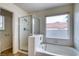 Modern bathroom with a separate shower and a luxurious garden tub at 7820 Wedlock Ln, Las Vegas, NV 89129