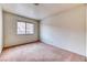 Carpeted bedroom featuring bright natural light from the window at 7820 Wedlock Ln, Las Vegas, NV 89129