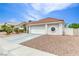 Charming single-story home with a tile roof, desert landscaping, and a two-car garage at 7820 Wedlock Ln, Las Vegas, NV 89129