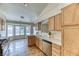 Bright kitchen with tile floors, light wood cabinets, and a view to the breakfast nook at 7820 Wedlock Ln, Las Vegas, NV 89129