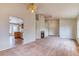 Spacious living room with fireplace, carpet, and easy access to the adjoining kitchen at 7820 Wedlock Ln, Las Vegas, NV 89129