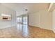 Expansive living area featuring tile flooring and views of kitchen and backyard at 7820 Wedlock Ln, Las Vegas, NV 89129