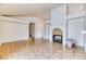 Spacious living room featuring tile floors, vaulted ceilings, and a cozy fireplace at 7820 Wedlock Ln, Las Vegas, NV 89129