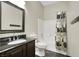 Full bathroom with black granite countertop, vanity, and a shower-tub combination with patterned shower curtain at 822 Fairview Dr, Henderson, NV 89015