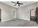 Spacious bedroom featuring gray flooring, a ceiling fan, and neutral paint at 822 Fairview Dr, Henderson, NV 89015