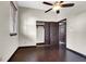 Bedroom with hardwood floors, a ceiling fan, and a sliding door closet, offering cozy comfort at 822 Fairview Dr, Henderson, NV 89015