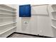 Walk in closet with blue cabinets and white shelving at 822 Fairview Dr, Henderson, NV 89015